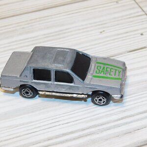 TOY CAR GRAY w  GREEN SAFTEY ON IT PLAYED WITH CONDITION